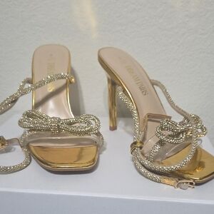 Elegant Gold High Heels with Bow Detail
